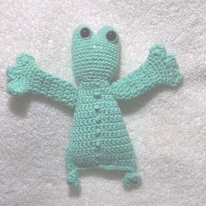 Hand crafted frog crocheted baby toy